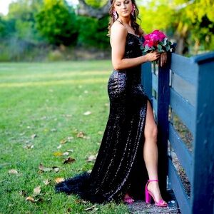 Black dress beautiful feather on the bottom!